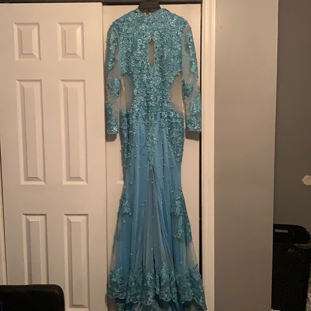 Lace dress with Embroidered Pearls it’s a Turquoise light blue.